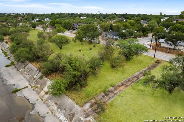 a view of a lake with a yard