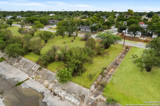 a view of a lake with huge green field