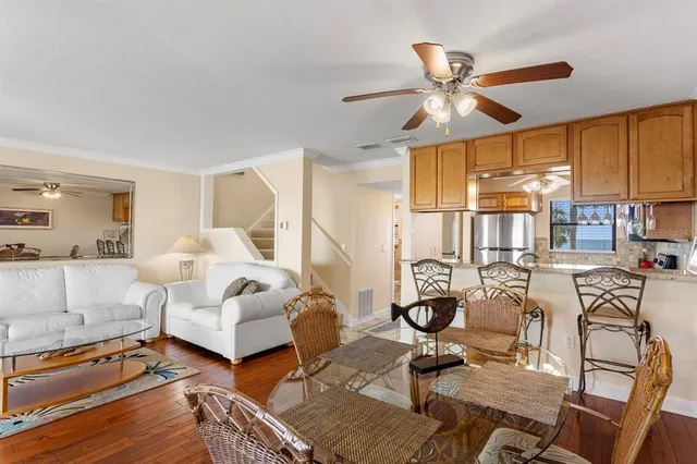 a view of a dining room with furniture and a window