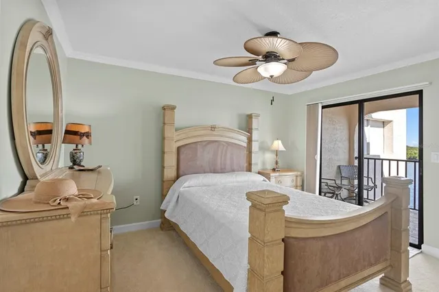 a spacious bedroom with a bed and a chandelier