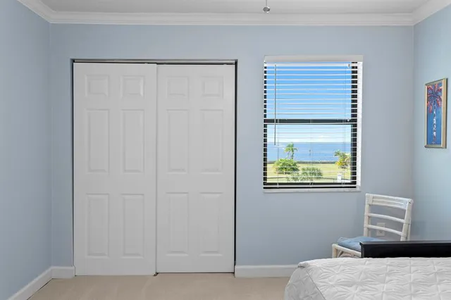a bathroom with a granite countertop toilet sink and mirror