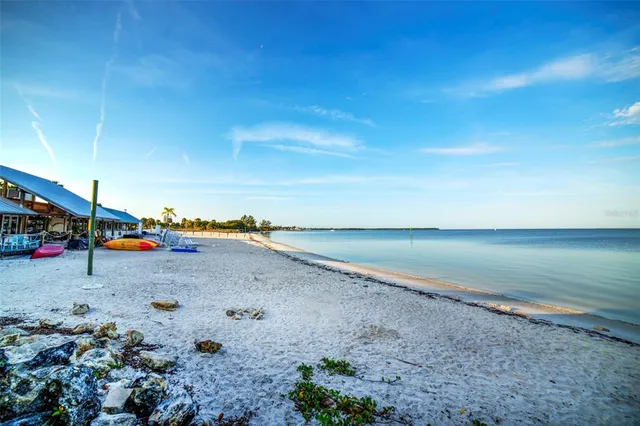 a outdoor space with lots of tables a chairs and a barbeque