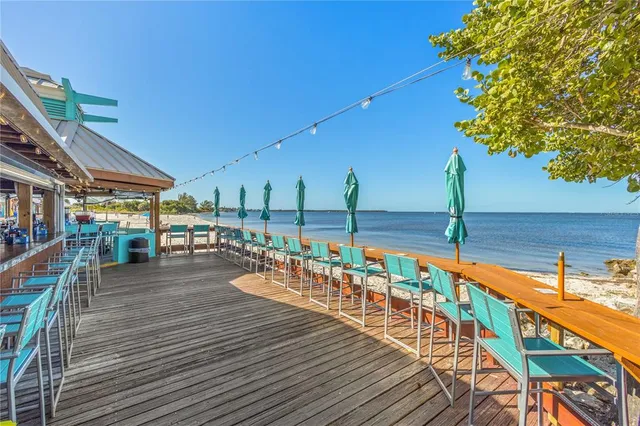 a terrace with outdoor seating and potted plants