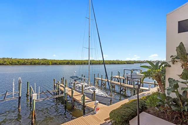 a view of empty room with furniture and floor to ceiling window