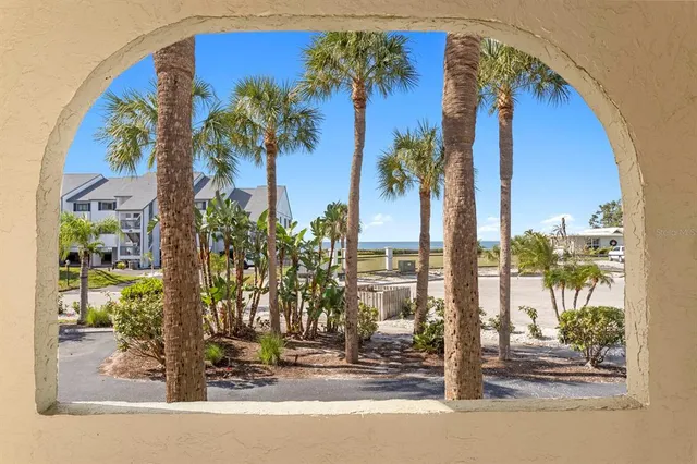 a view of a kitchen with a sink and cabinets