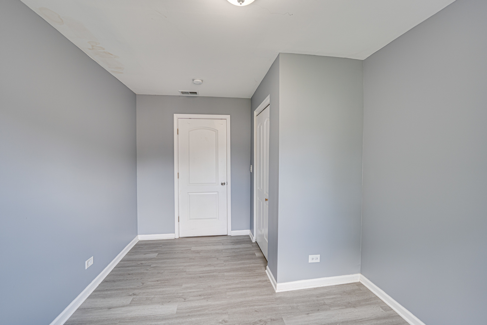 208 Mound Street, Unit 2 Joliet, IL 60433 - Photo 15 of 18 a view of an empty room with wooden floor