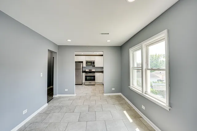 a view of an empty room with a window