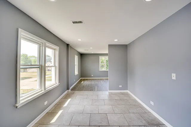 a view of an empty room and window