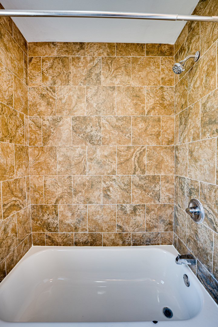 208 Mound Street, Unit 2 Joliet, IL 60433 - Photo 10 of 18 a bathroom with a bathtub