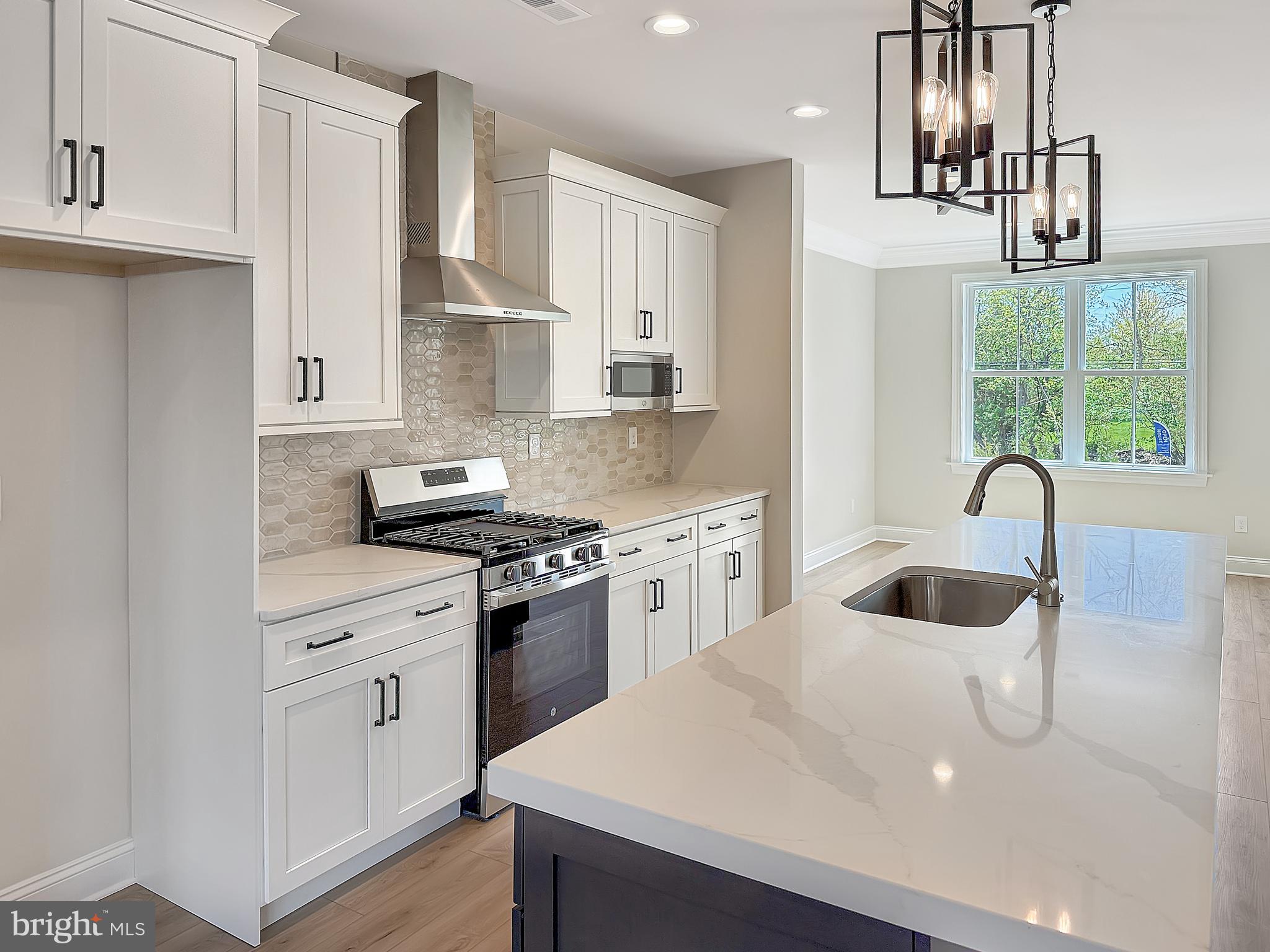 9 Schadle Road Perkasie, PA 18944 - Photo 12 of 44 a kitchen with white cabinets and appliances