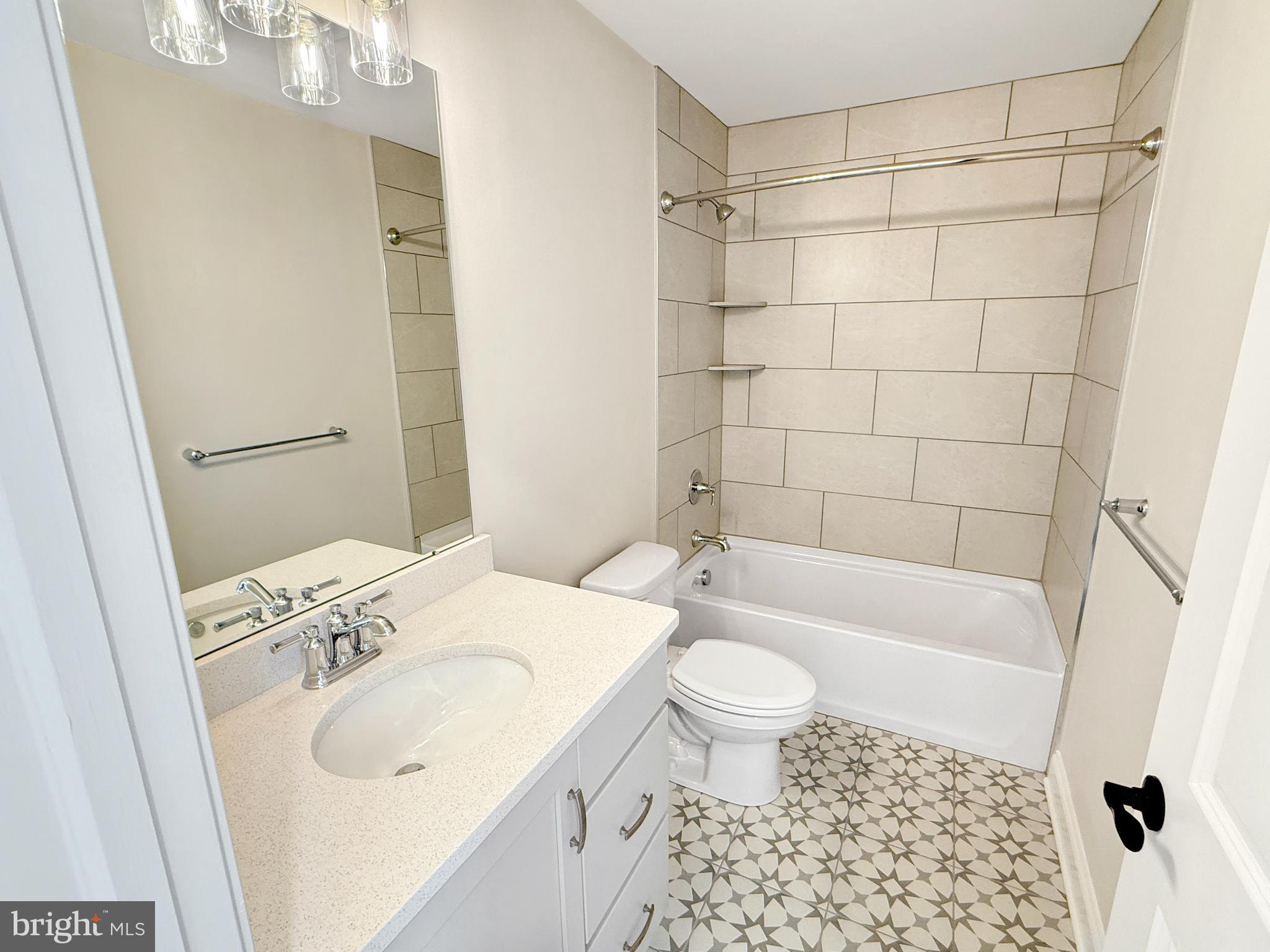 9 Schadle Road Perkasie, PA 18944 - Photo 26 of 44 a bathroom with a sink a toilet and shower