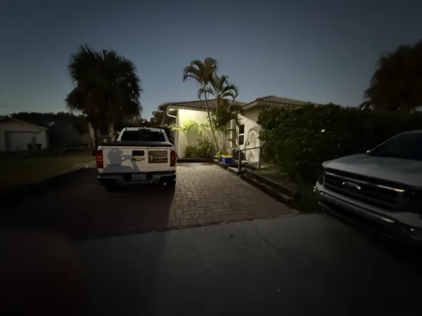 a view of a swimming pool and outside seating area