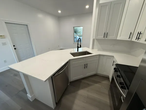 a view of kitchen with wooden floor