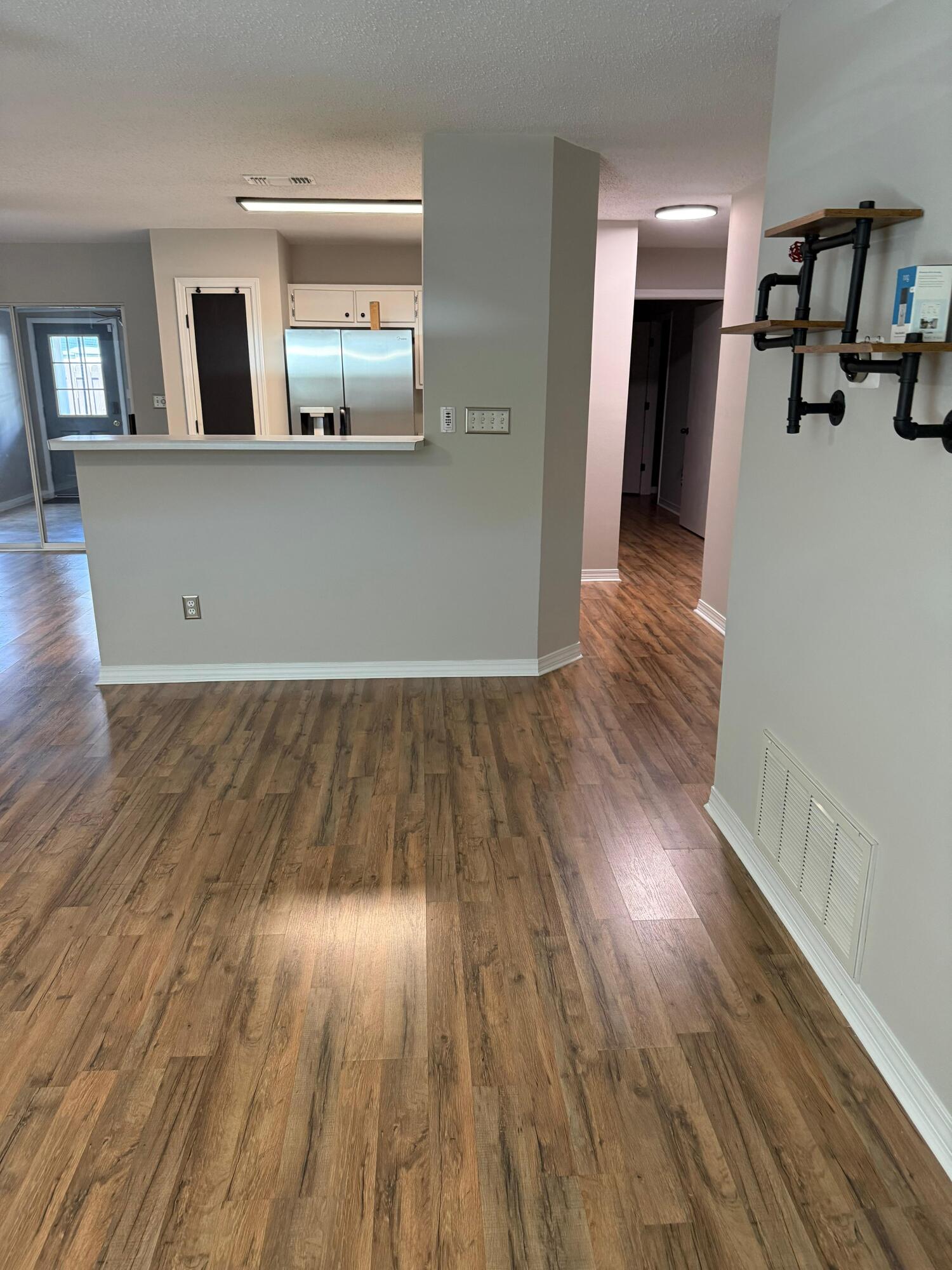 38 Ruby Circle Mary Esther, FL 32569 - Photo 11 of 50 a view of a living room with wooden floor