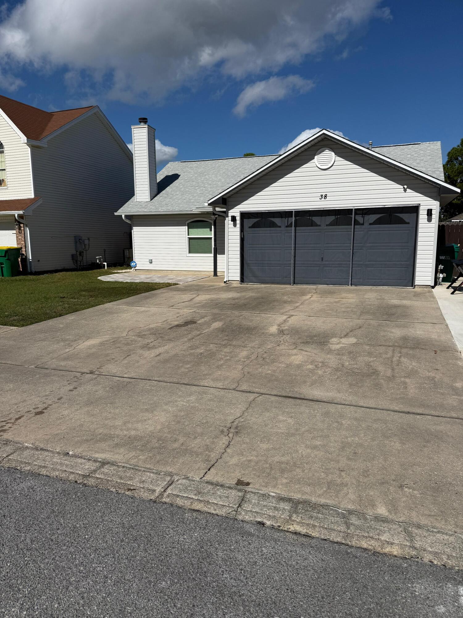 38 Ruby Circle Mary Esther, FL 32569 - Photo 2 of 50 a front view of a house with a yard and garage