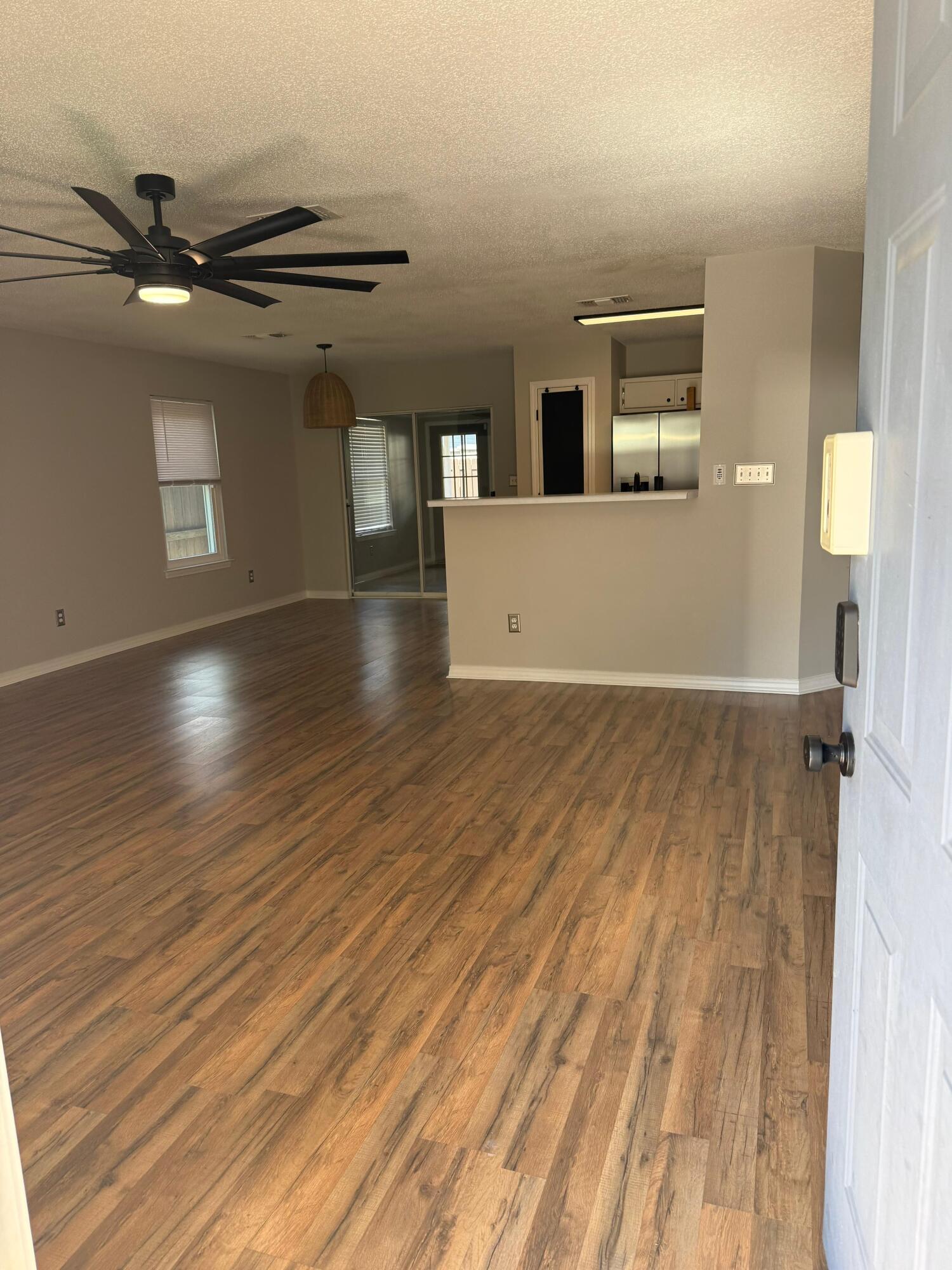 38 Ruby Circle Mary Esther, FL 32569 - Photo 21 of 50 wooden floor in an empty room with a window