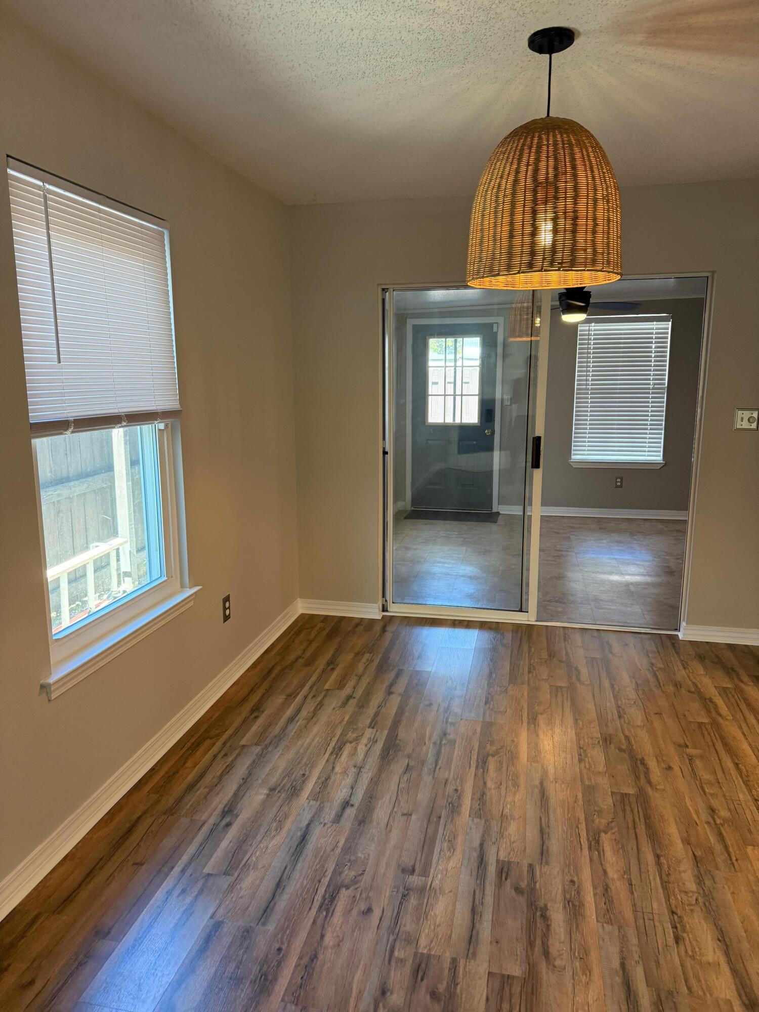 38 Ruby Circle Mary Esther, FL 32569 - Photo 23 of 50 a view of empty room with wooden floor and fan
