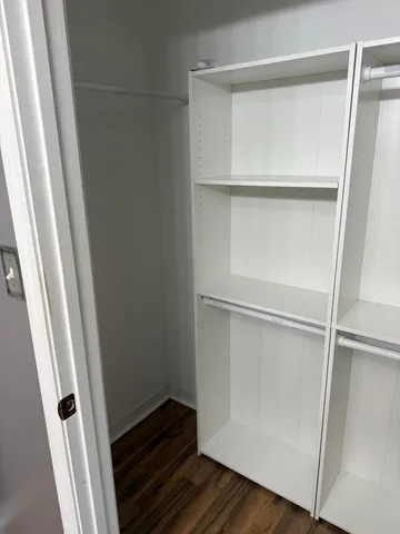 a close view of closet with wooden floor