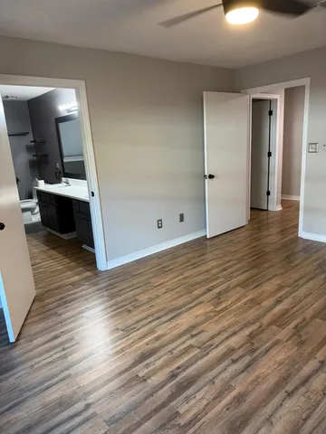 a bathroom with a double vanity sink mirror and toilet