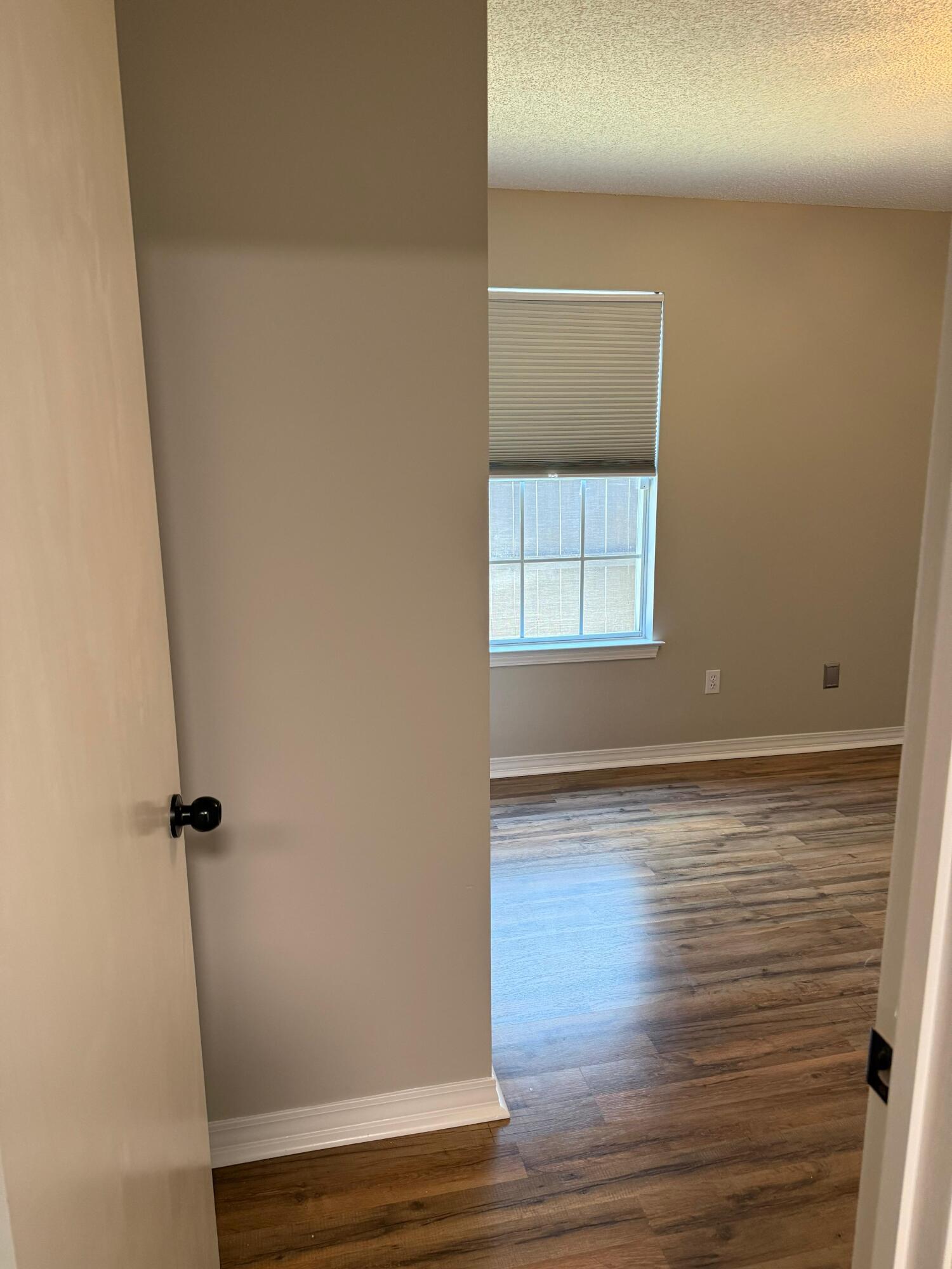 38 Ruby Circle Mary Esther, FL 32569 - Photo 44 of 50 a view of empty room with wooden floor and fan