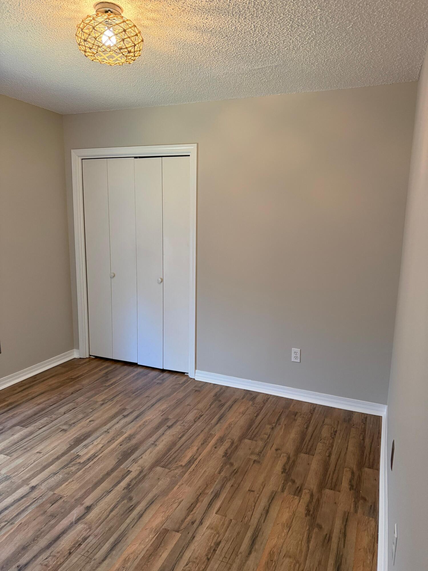 38 Ruby Circle Mary Esther, FL 32569 - Photo 45 of 50 a view of an empty room with wooden floor and a window