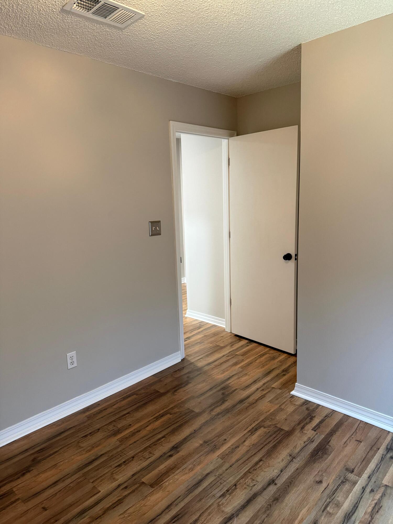38 Ruby Circle Mary Esther, FL 32569 - Photo 46 of 50 a view of an empty room with wooden floor