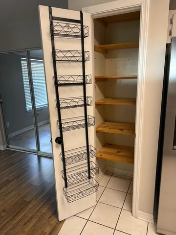 a view of a living room with wooden floor