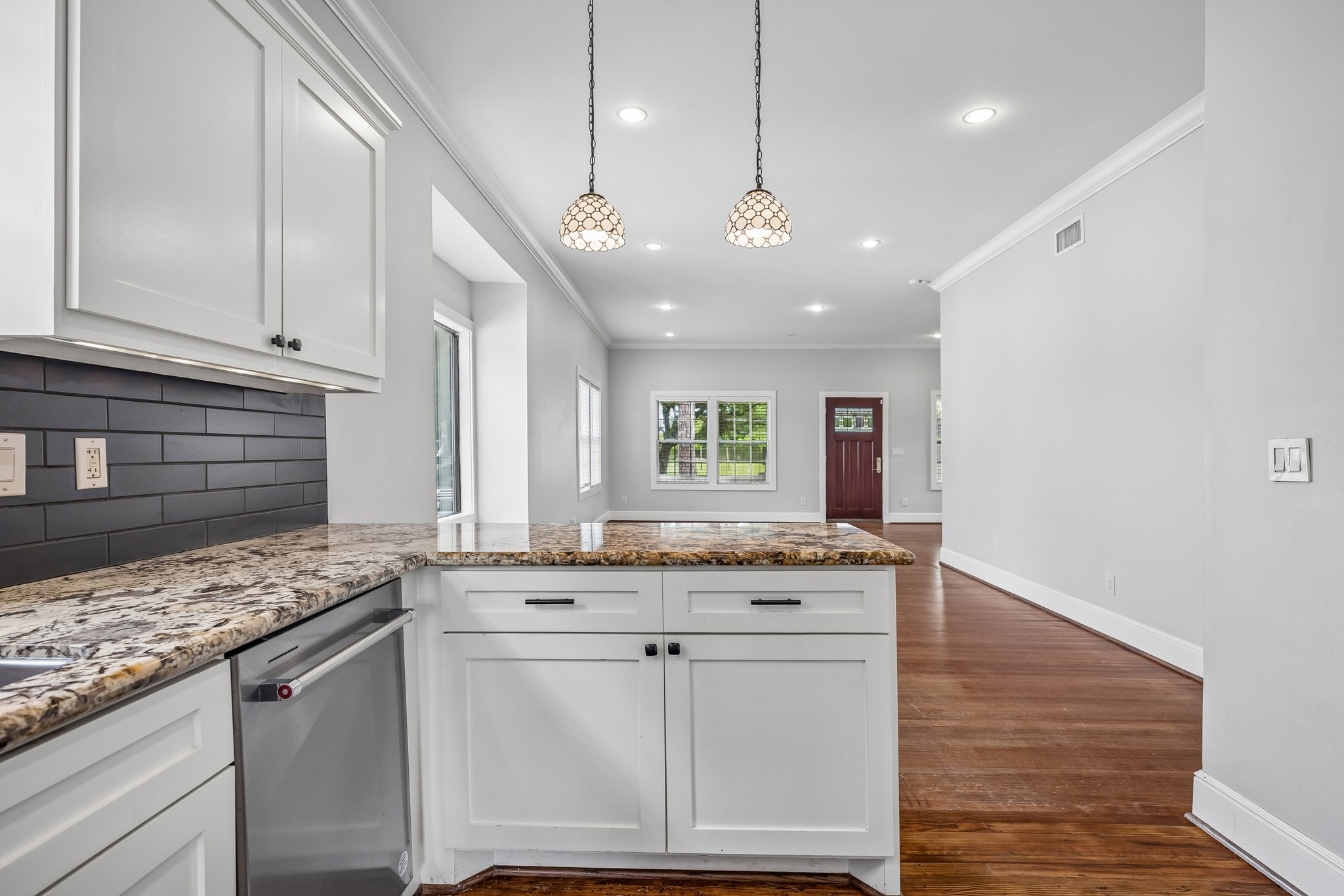 4412 Rusk Street Houston, TX 77023 - Photo 15 of 44 Breakfast bar, with lovely pendant lights, is open to the living areas and offers the perfect spot for family & friends to gather.