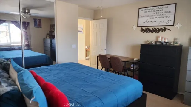 a bedroom with a bed and a table