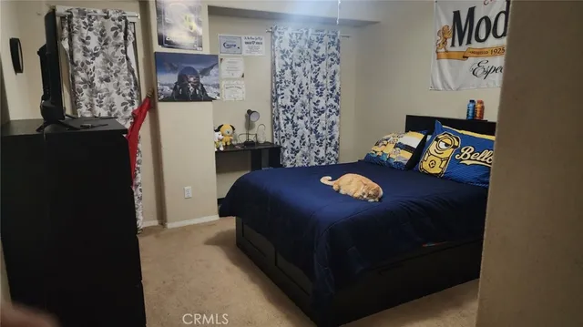 a bedroom with a bed and a table in it