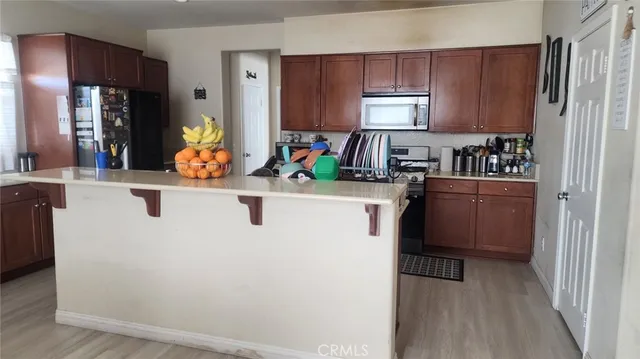 a kitchen with cabinets and appliances