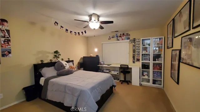 a bed room with a bed furniture and a chandelier