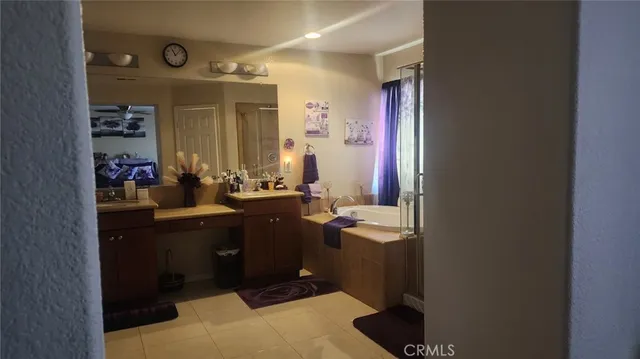 a bathroom with a sink vanity and mirror