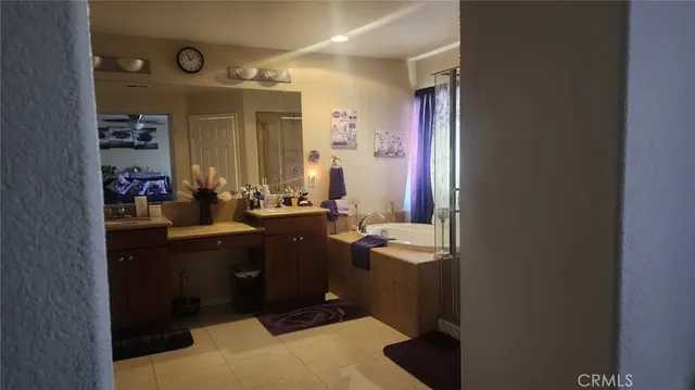 a bathroom with a sink vanity and mirror