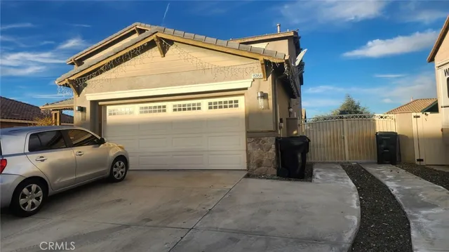 a view of a car park in front of house
