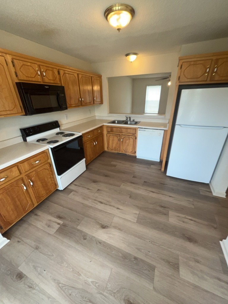 241 Tree Line Drive Oak Grove, KY 42262 - Photo 4 of 19 a large kitchen with stainless steel appliances granite countertop a stove a sink and a microwave