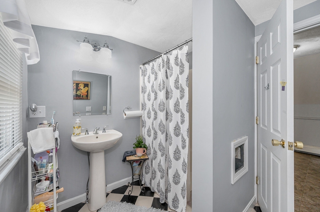 180 Foster Road Tewksbury, MA 01876 - Photo 19 of 38 a bathroom with a sink toilet and shower