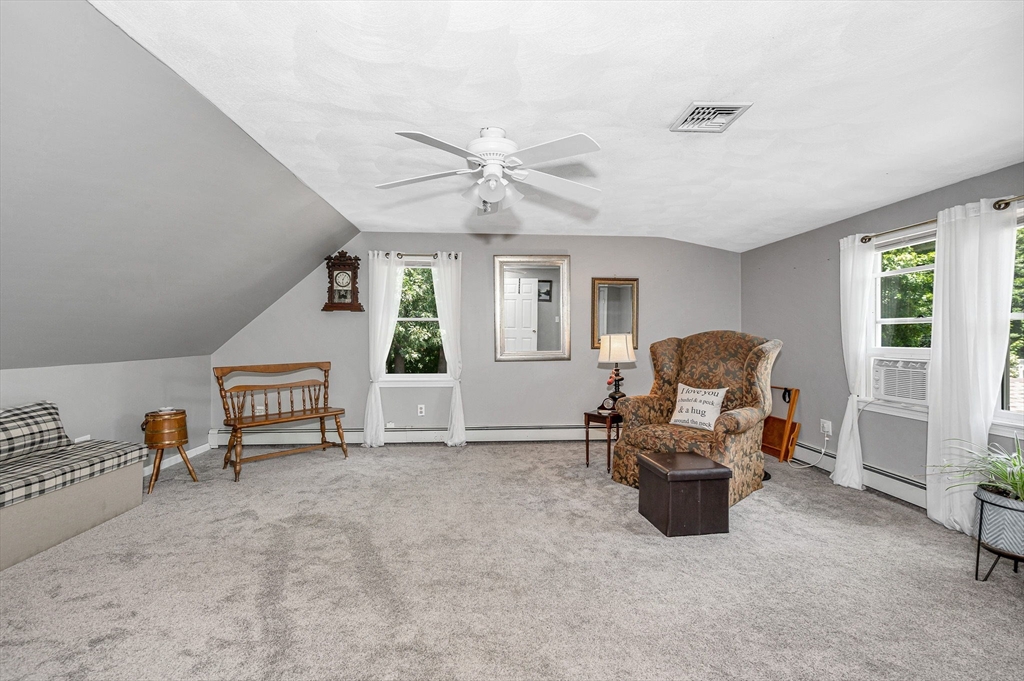180 Foster Road Tewksbury, MA 01876 - Photo 20 of 38 a living room with furniture and a window