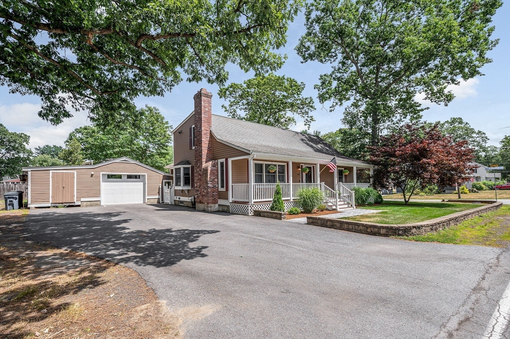 180 Foster Road Tewksbury, MA 01876 - Photo 2 of 38 a front view of a house with a yard