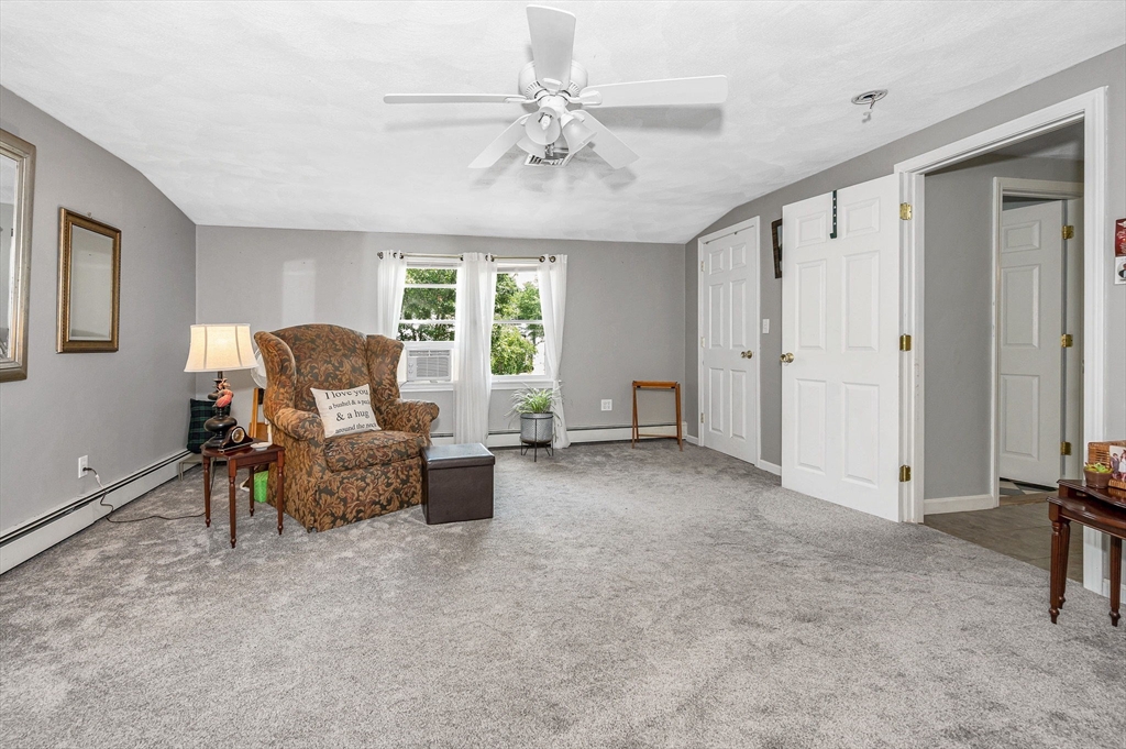 180 Foster Road Tewksbury, MA 01876 - Photo 21 of 38 a living room with furniture and a window