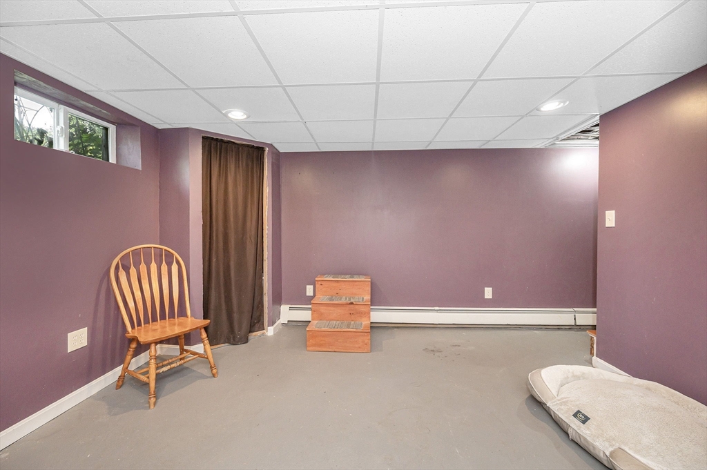 180 Foster Road Tewksbury, MA 01876 - Photo 23 of 38 a hallway with couches and a potted plant