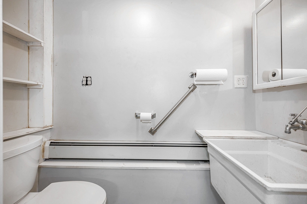 180 Foster Road Tewksbury, MA 01876 - Photo 26 of 38 a bathroom with a sink a toilet and vanity