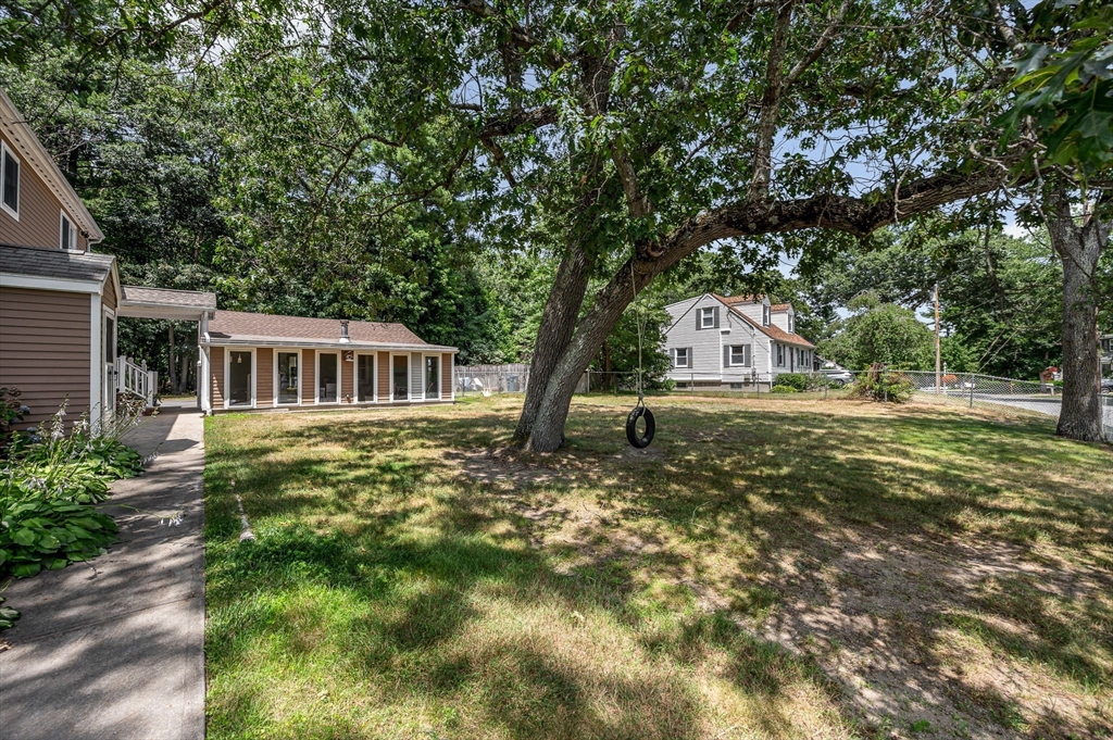 180 Foster Road Tewksbury, MA 01876 - Photo 30 of 38 a view of a house with a garden