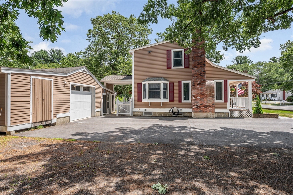 180 Foster Road Tewksbury, MA 01876 - Photo 33 of 38 front view of a house with a street