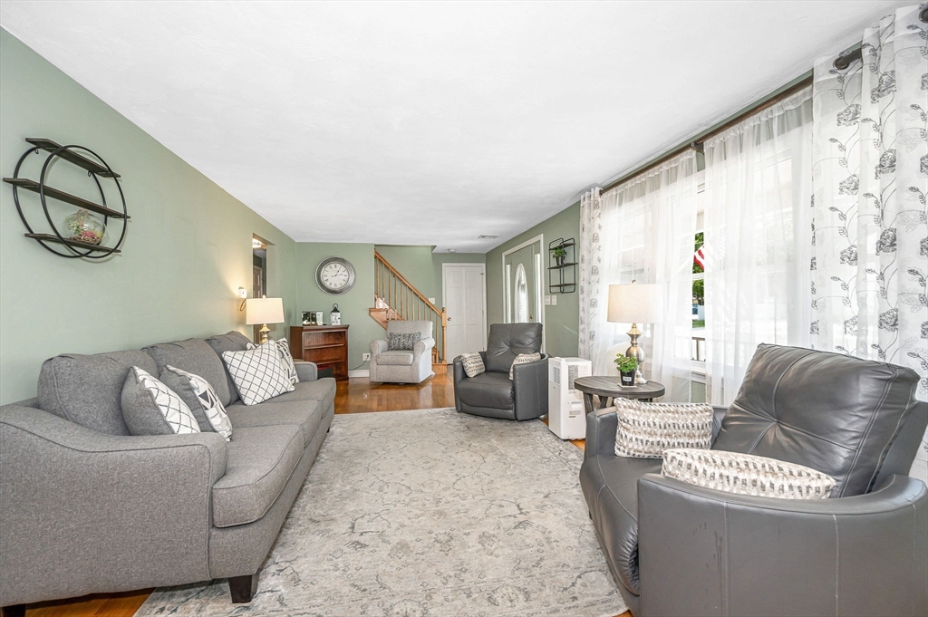 180 Foster Road Tewksbury, MA 01876 - Photo 4 of 38 a living room with furniture and a large window