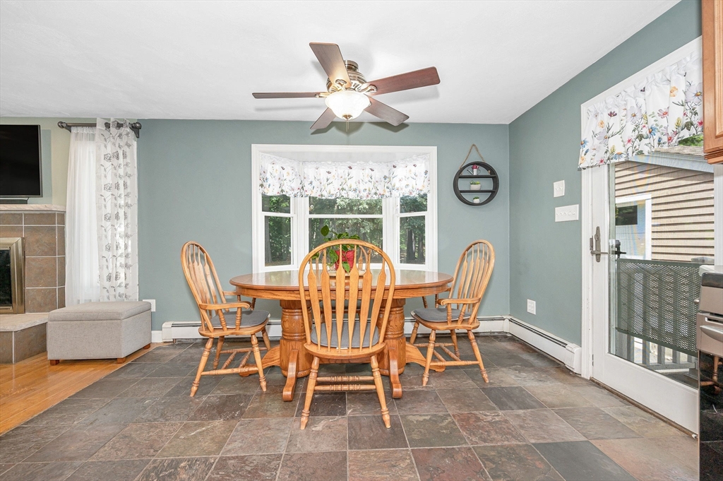 180 Foster Road Tewksbury, MA 01876 - Photo 7 of 38 a dining room with furniture and window