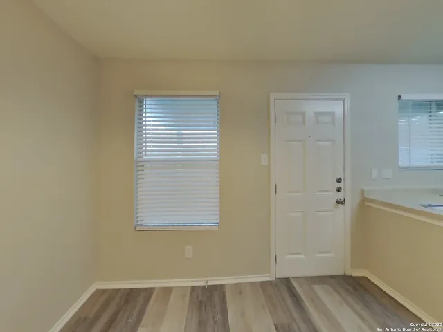a view of a room that has a window in it