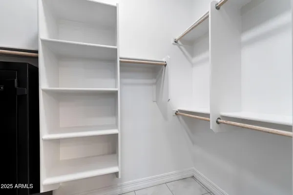 a view of an empty walk in closet