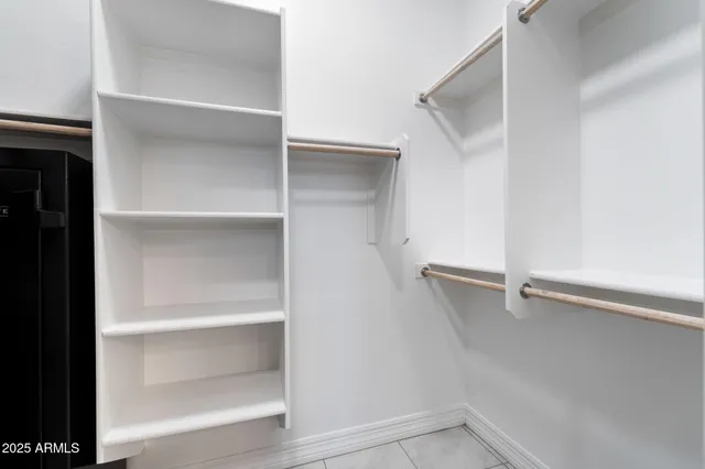 a view of an empty walk in closet