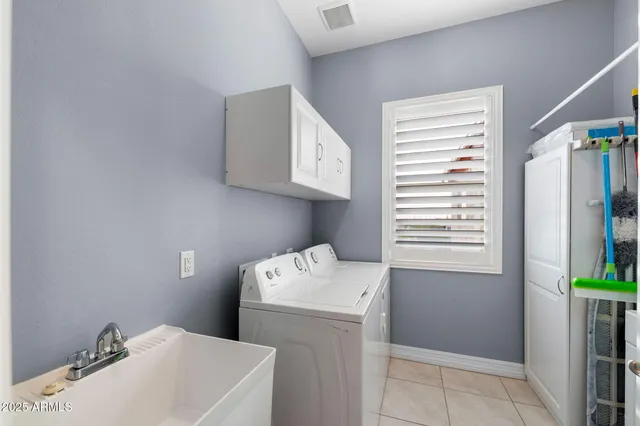 a utility room with a window dryer and washer
